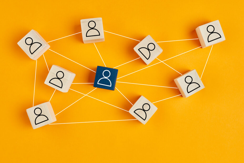 wooden-blocks-with-people-icon-on-yellow-background-organization-structure-social-network-leadership-team-building-recruitment-management-or-human-resources-concepts