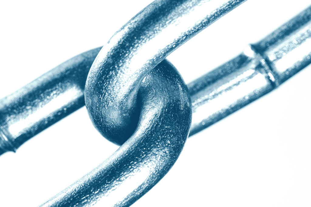 close up of two interlocked links of a chain