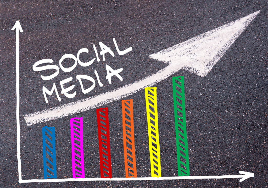 colorful-graph-drawn-over-tarmac-and-directional-arrow